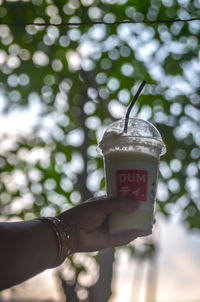 Close-up of hand holding drink