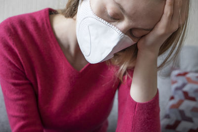 Close-up portrait of woman at home