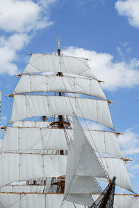 Low angle view of sailboat on sea against sky