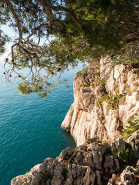 High angle view of rock formation by sea