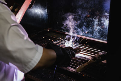 High angle view of man working on machine