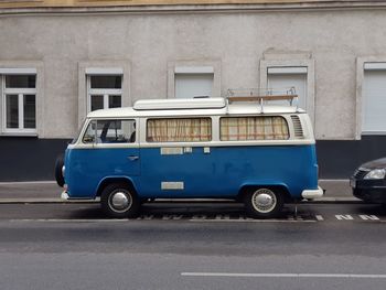 Car parked on road by building