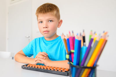 Child with learning difficulty in occupational therapy. a boy during math tutoring session.