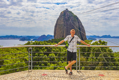 Tourist traveler poses at sugarloaf mountain rio de janeiro brazil.