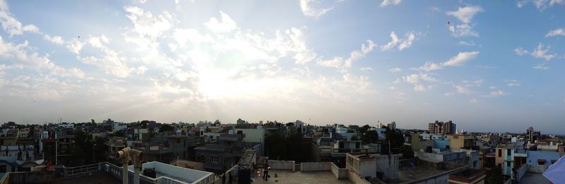 Panoramic view of town against sky