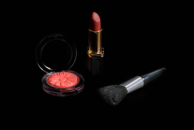 High angle view of coins on black background