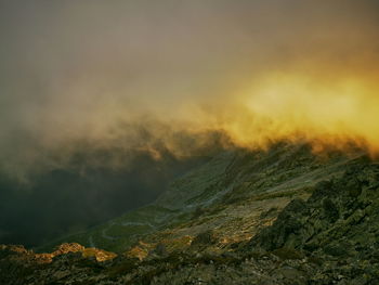 Scenic view of mountains against sky during sunset