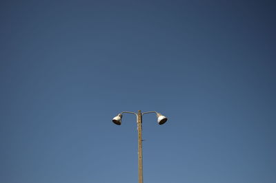 Low angle view of street light against clear sky