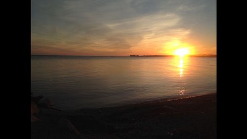 Scenic view of sea at sunset