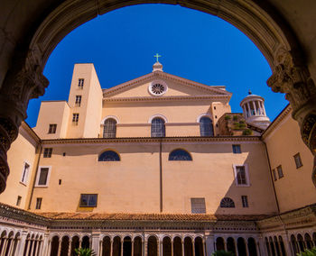 Low angle view of historic building against clear blue sky