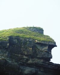 Low angle view of rock formation against clear sky