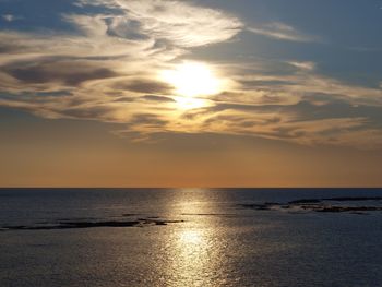 Scenic view of sunset over calm sea