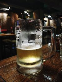 Close-up of beer glass on table