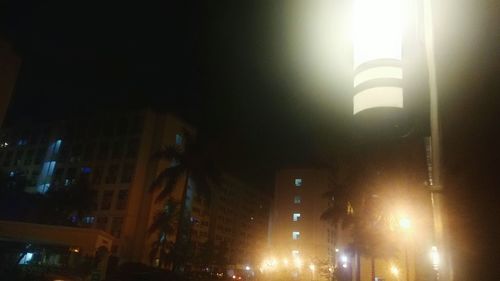 Low angle view of illuminated building at night