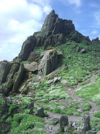 Low angle view of rock formations against sky