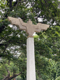 Low angle view of cross on cemetery