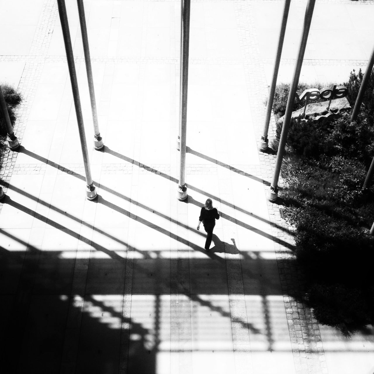 built structure, architecture, walking, connection, indoors, power line, silhouette, clear sky, reflection, tree, men, day, railing, glass - material, window, cable, building exterior, low angle view