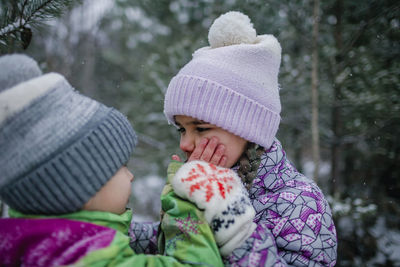 Cute kids paying outdoors during winter