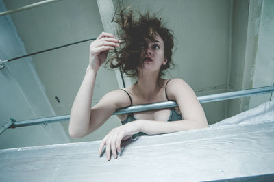 Portrait of beautiful young woman holding water