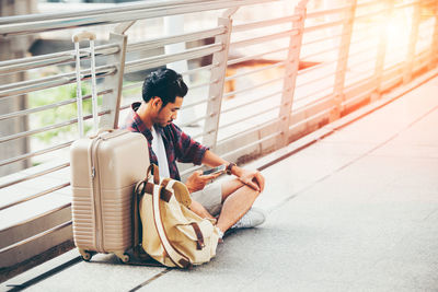 Full length of woman sitting in bus