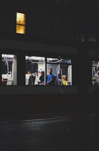 People in bus at night