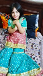 Portrait of a girl sitting on sofa