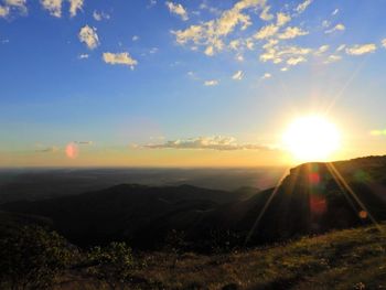 Scenic view of landscape against sky during sunset