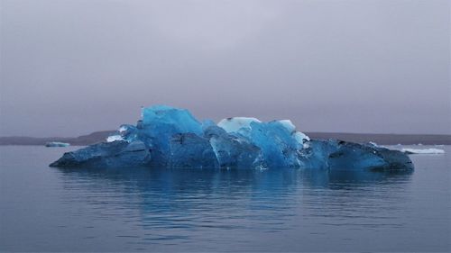 Scenic view of sea against sky during winter