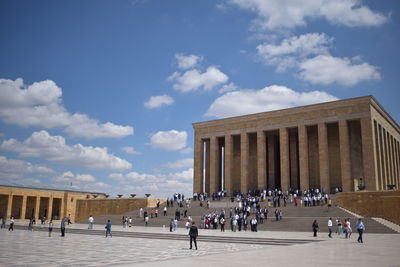 Group of people in front of historical building