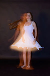 Digital composite image of woman dancing on floor