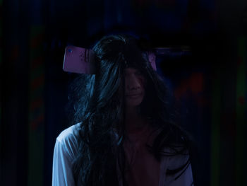 Young man wearing halloween costume against black background