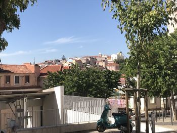 Street amidst buildings against sky