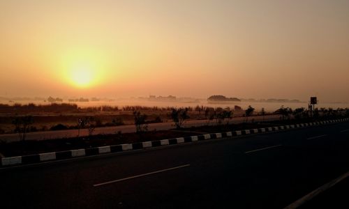 Scenic view of landscape at sunset