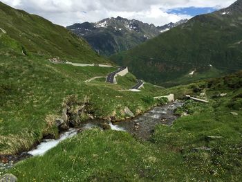 Stream with mountain range in background