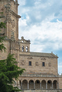 Low angle view of historic building against cloudy sky