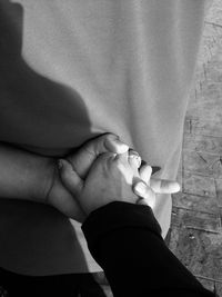 High angle view of couple holding hands