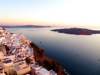 Panoramic view of sea and city against clear sky