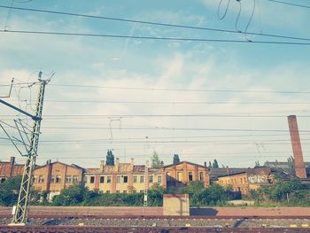 Houses against sky in city
