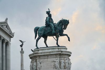 Low angle view of statue against sky