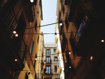 Low angle view of buildings in city against sky