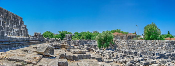 Ruins of building against blue sky