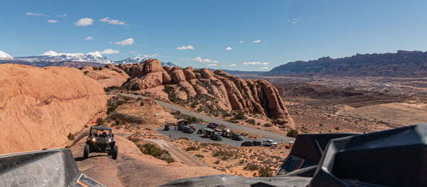 Panoramic view of a 4x4 tour in rugged sandstone terrain on a trail called hell's revenge