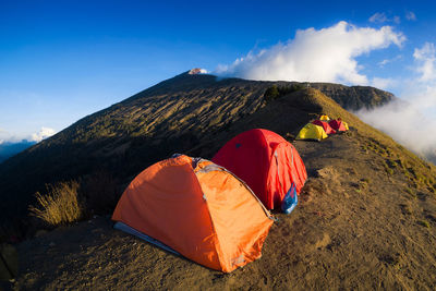 Tent on mountain against sky