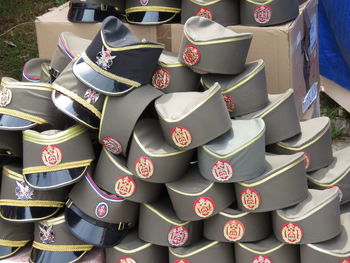 Stack of army caps on land