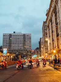 City street and buildings against sky