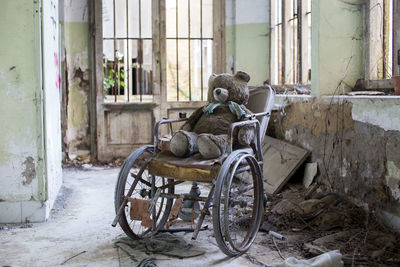 View of wheelchair in abandoned building