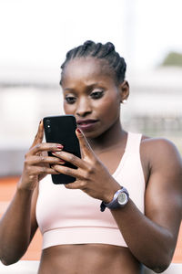 Young woman using mobile phone