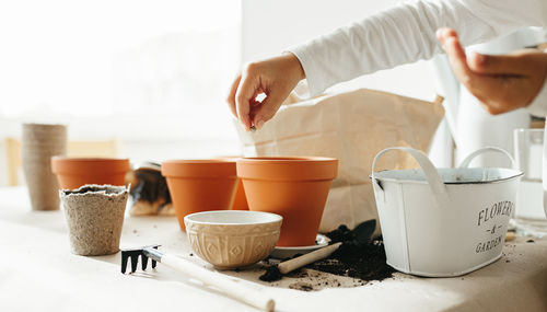 High angle view of woman gardening on table