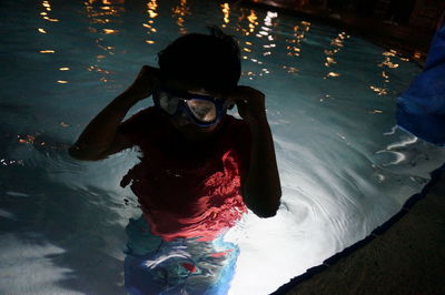 High angle view of woman swimming in pool