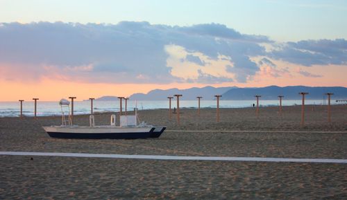 Scenic view of beach against sky during sunset